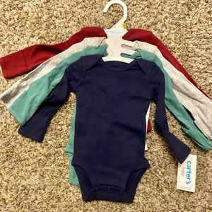 Newborn 4 pack onesies. New with tags